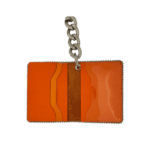 BB Simon Belt Providing you a purse embed a logo stamp of BB Simon on a Orange color Wallet with a silver color of chain